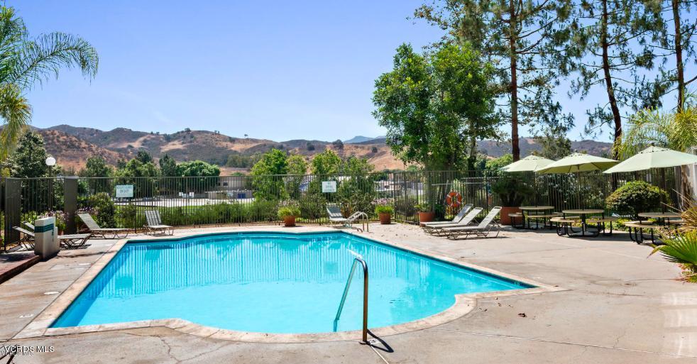 4240 Lost Hills Road, Unit 2907 Calabasas, CA 91301 - Photo 1 of 31 a view of a swimming pool with a lounge chairs
