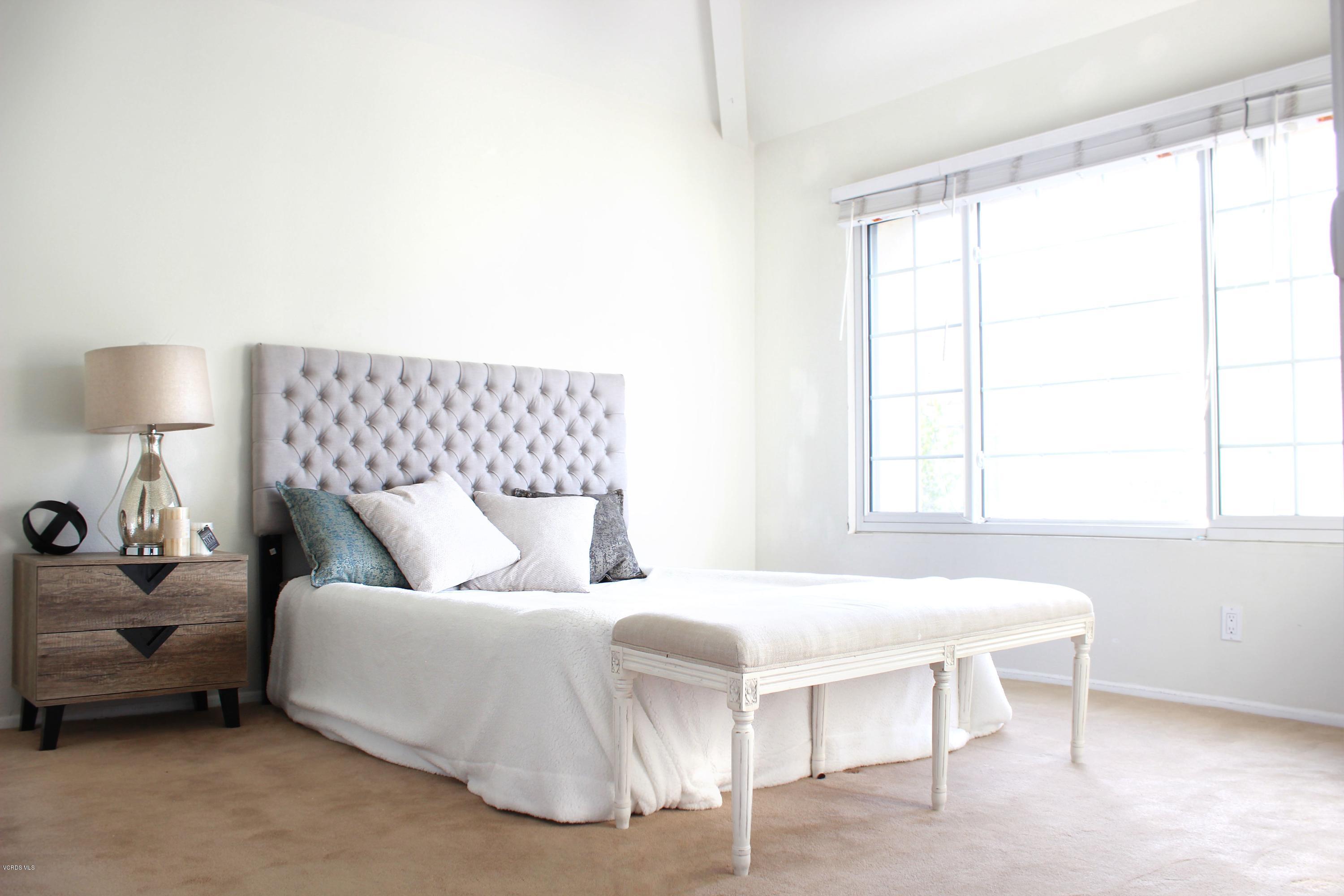4240 Lost Hills Road, Unit 2907 Calabasas, CA 91301 - Photo 13 of 31 a bedroom with a bed and a window