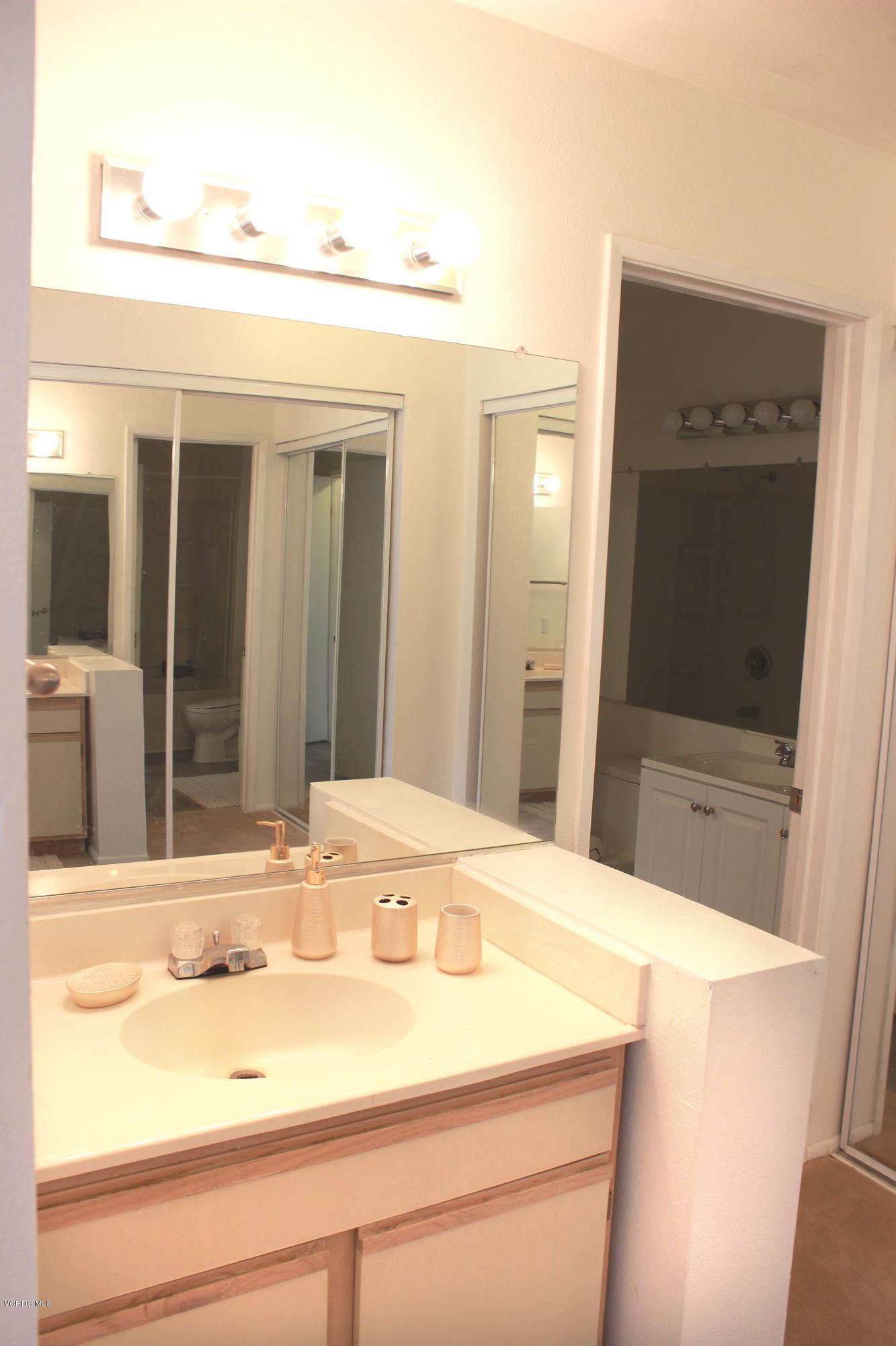 4240 Lost Hills Road, Unit 2907 Calabasas, CA 91301 - Photo 16 of 31 a bathroom with a sink and a mirror