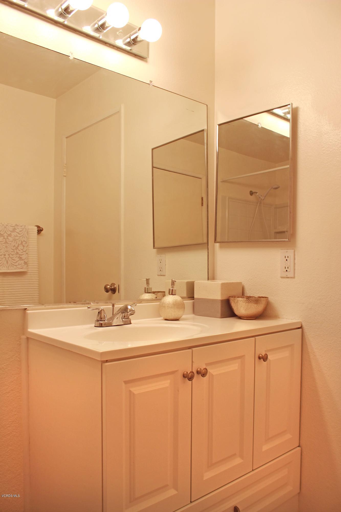 4240 Lost Hills Road, Unit 2907 Calabasas, CA 91301 - Photo 18 of 31 a bathroom with a sink and a mirror
