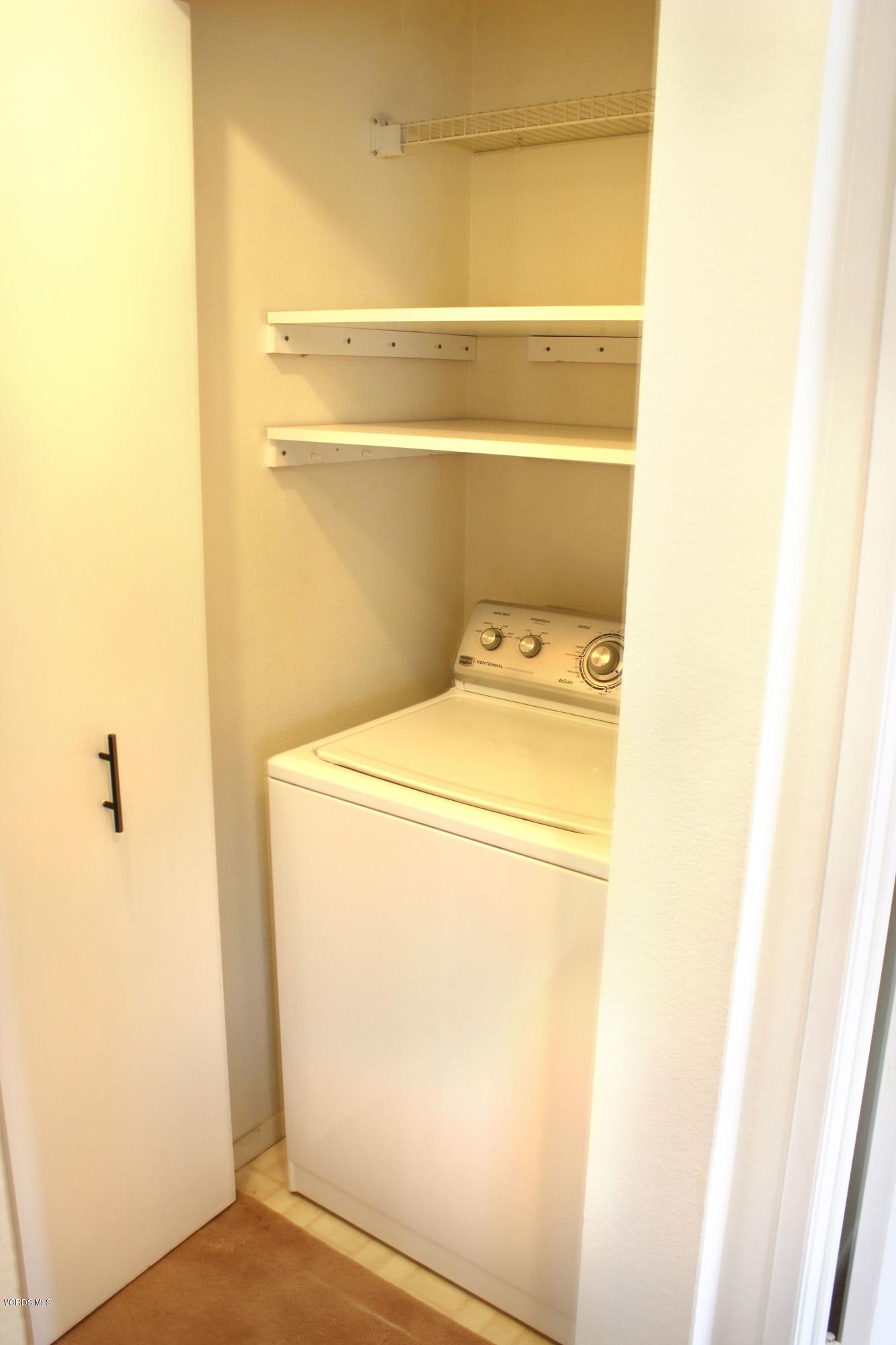 4240 Lost Hills Road, Unit 2907 Calabasas, CA 91301 - Photo 20 of 31 a utility room with dryer and washer