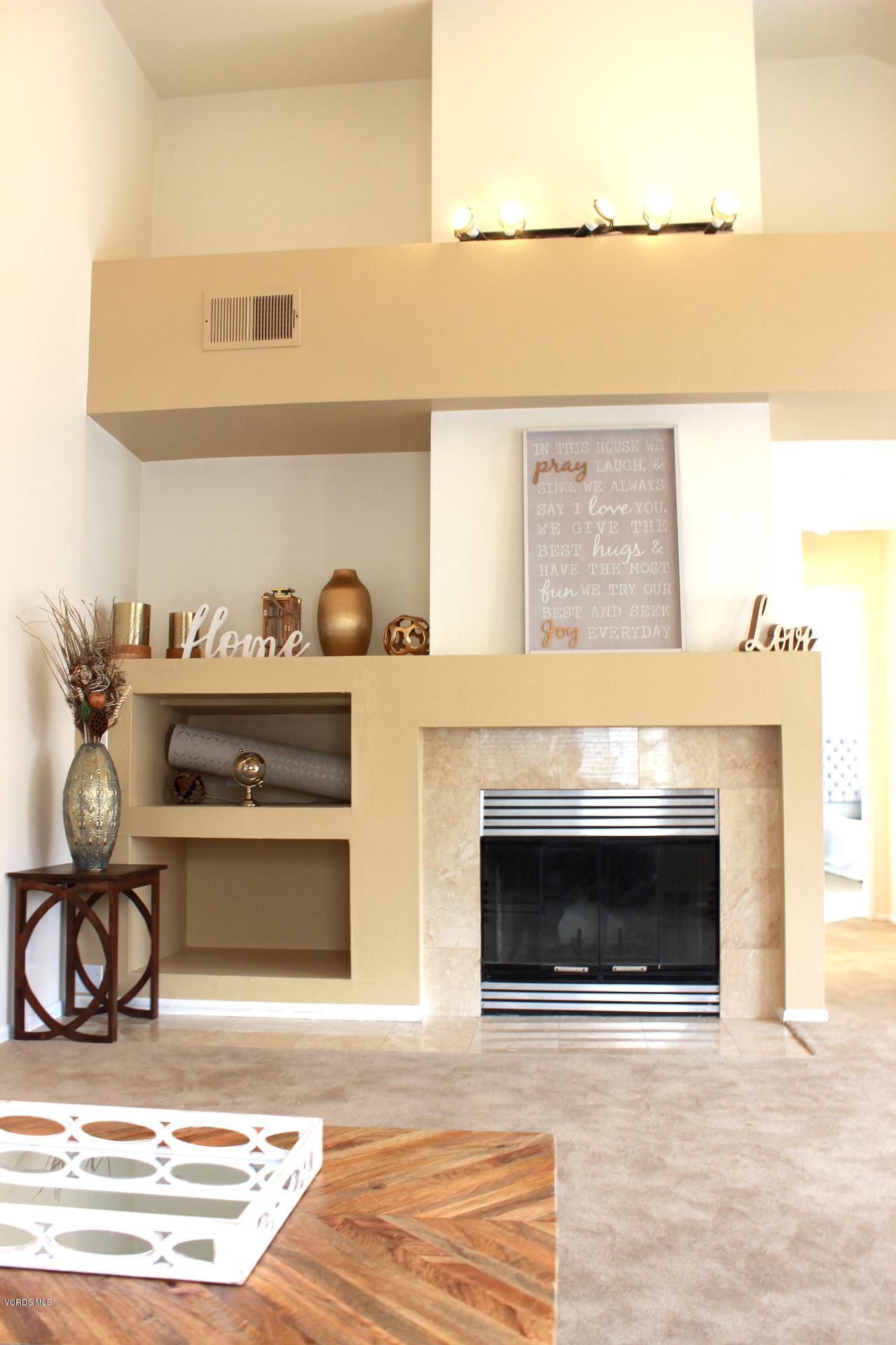 4240 Lost Hills Road, Unit 2907 Calabasas, CA 91301 - Photo 3 of 31 a living room with furniture and a fireplace