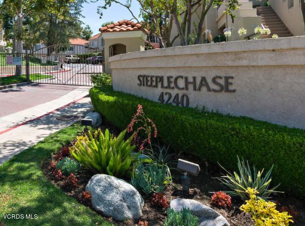 4240 Lost Hills Road, Unit 2907 Calabasas, CA 91301 - Photo 29 of 31 a front view of a house with a yard and outdoor seating