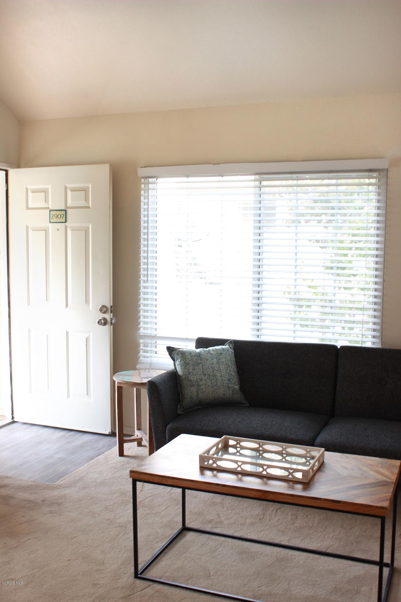 4240 Lost Hills Road, Unit 2907 Calabasas, CA 91301 - Photo 4 of 31 a living room with furniture and a window