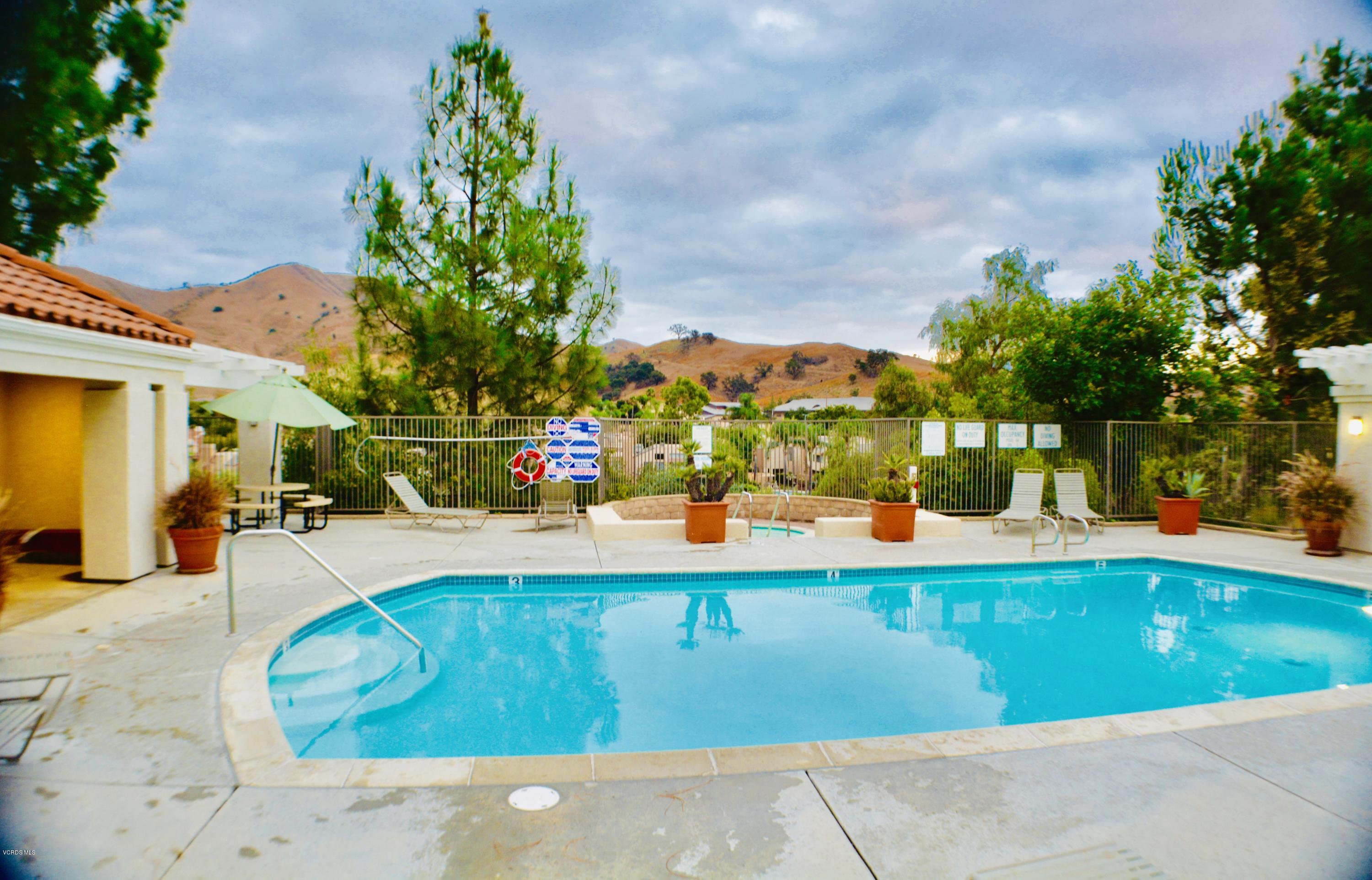 4240 Lost Hills Road, Unit 2907 Calabasas, CA 91301 - Photo 31 of 31 a view of a swimming pool with an outdoor seating