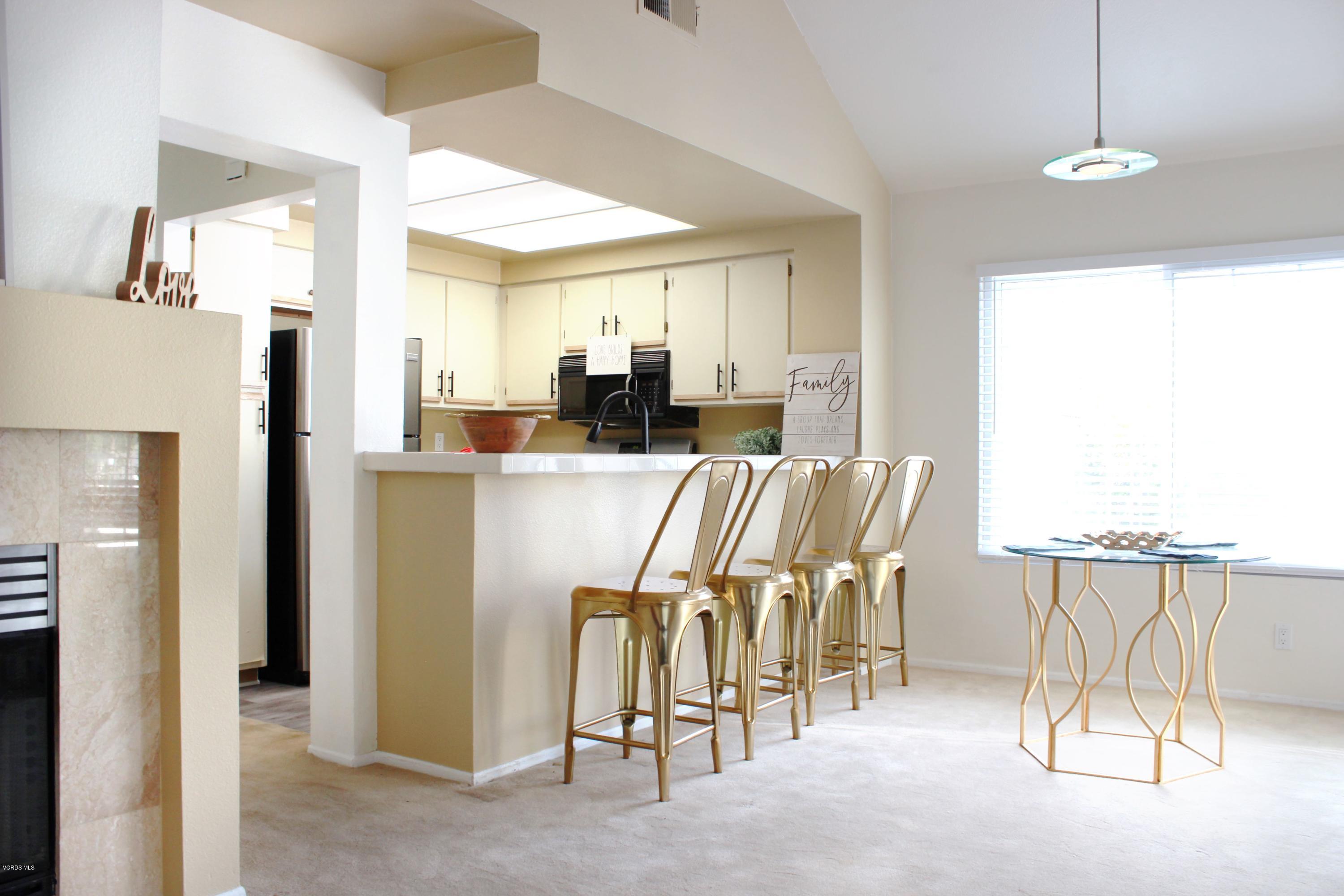 4240 Lost Hills Road, Unit 2907 Calabasas, CA 91301 - Photo 5 of 31 a dining room with furniture and a chandelier