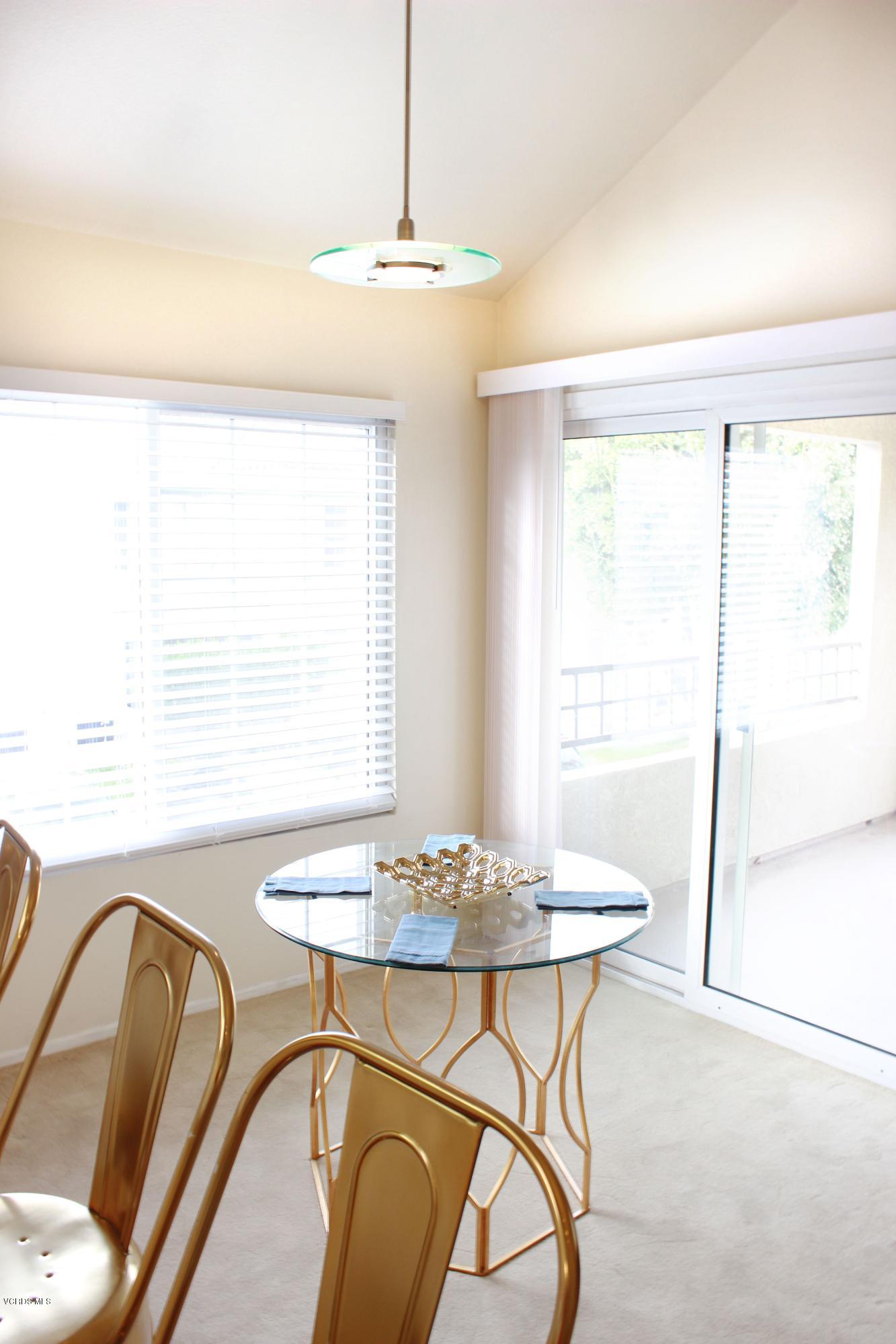 4240 Lost Hills Road, Unit 2907 Calabasas, CA 91301 - Photo 7 of 31 a view of a dining room with furniture window and outside view