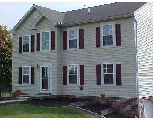 132 Cedar Ridge Drive Monaca, PA 15061 - Photo 2 of 14 Exterior Front. The lot offers a large back yard, blacktop dirveway, to 2 car garage, rose garden and a great back yard.