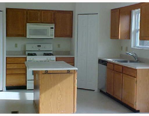 132 Cedar Ridge Drive Monaca, PA 15061 - Photo 5 of 14 Kitchen. TAKE A LOOK AT THIS. Newly painted kitchen with oak cabinets. 2 storage pantrys. The ref., gas stove, microwave, and dishwasher is included in the sale.