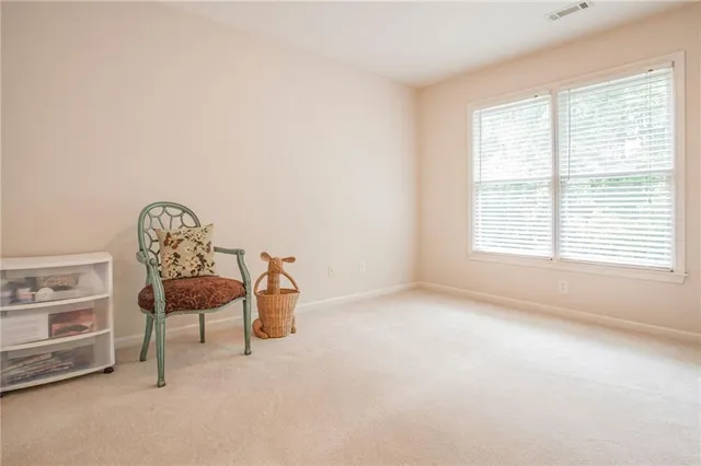 a room with a window and a chair