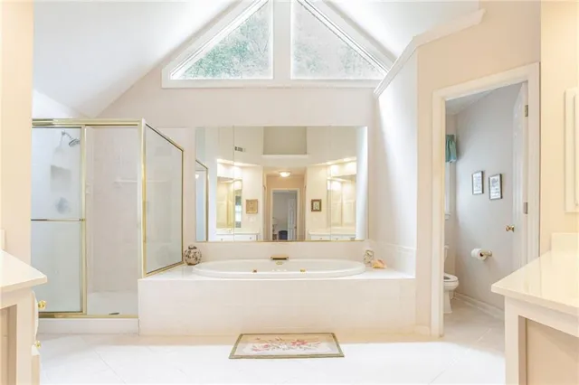 a view of bathroom with bathtub and shower