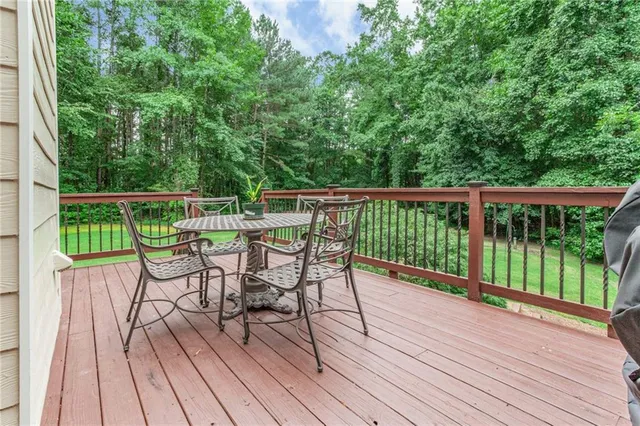 a view of a backyard with sitting area