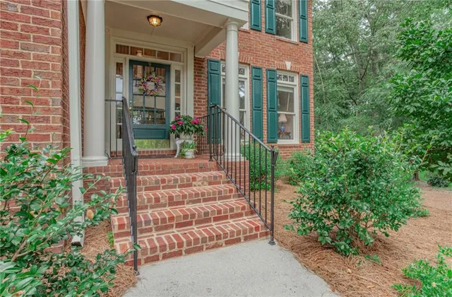 front view of a house with a garden