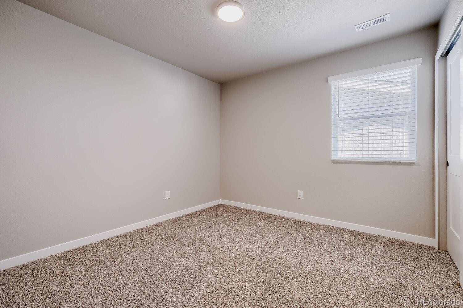 471 Atchison Way Calhan, CO 80808 - Photo 24 of 31 an empty room with a window