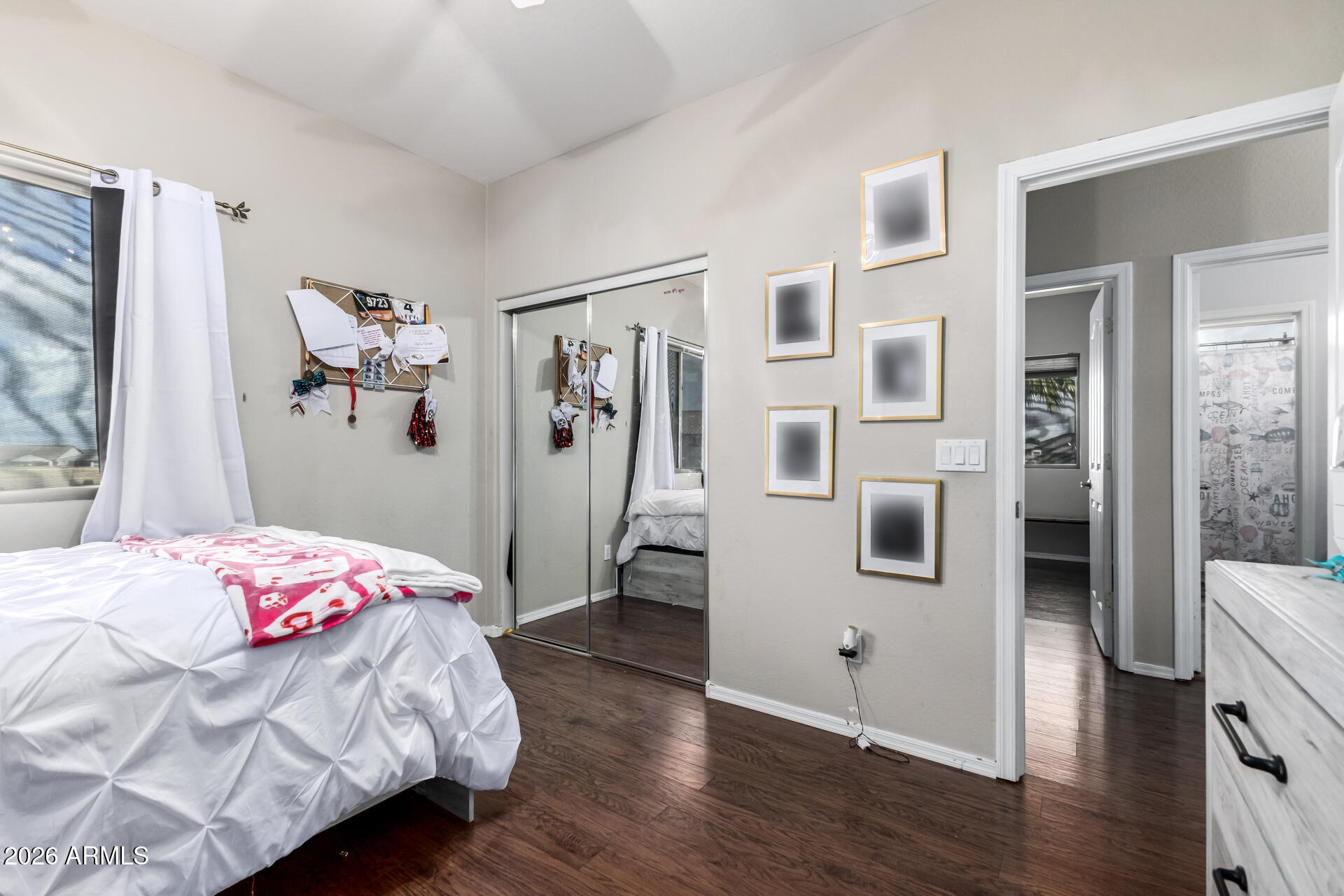 24541 Plum Road Florence, AZ 85132 - Photo 27 of 47 a bedroom with a bed and wooden floor