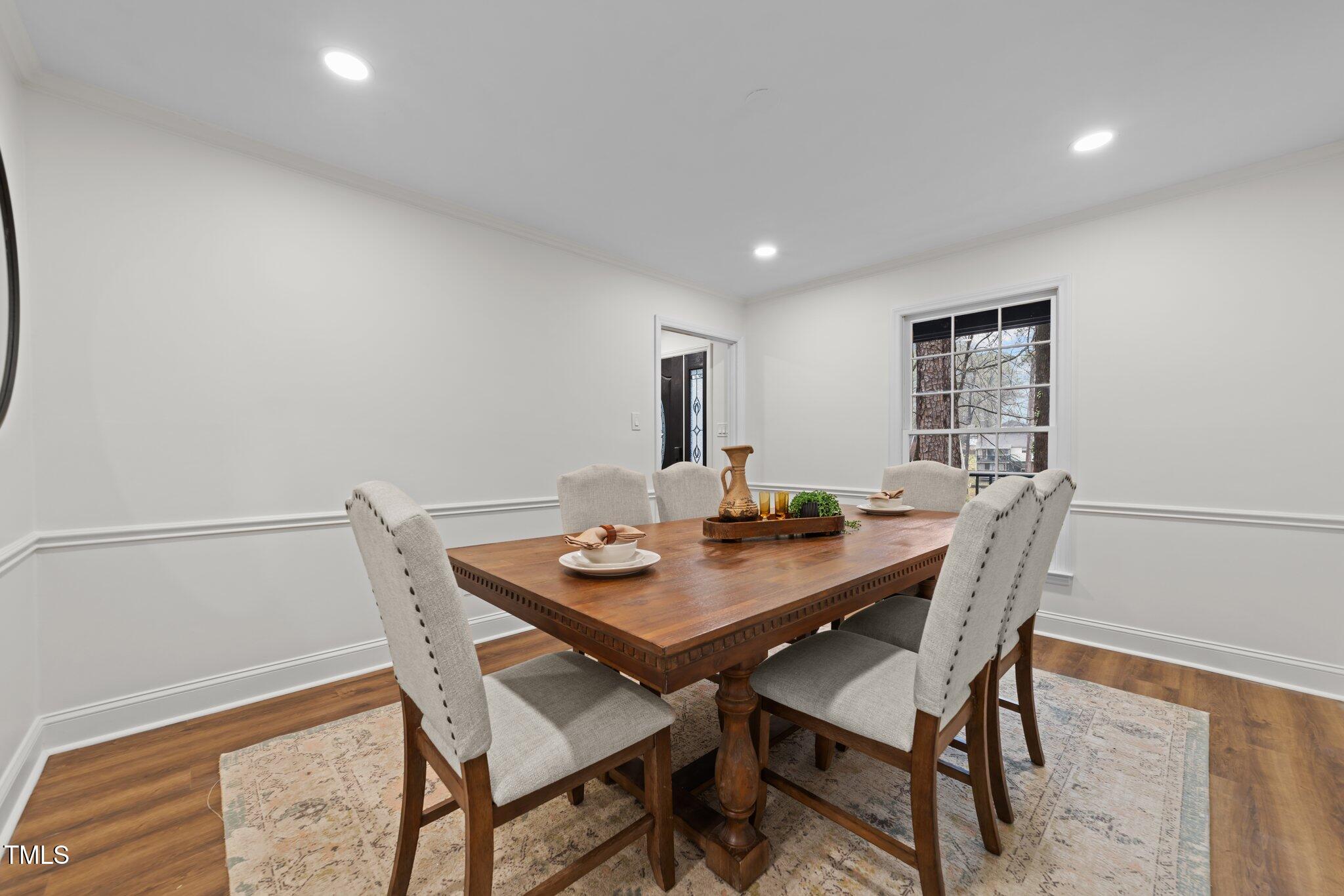 2001 Quail Ridge Road Raleigh, NC 27609 - Photo 16 of 40 a view of a dining room with furniture