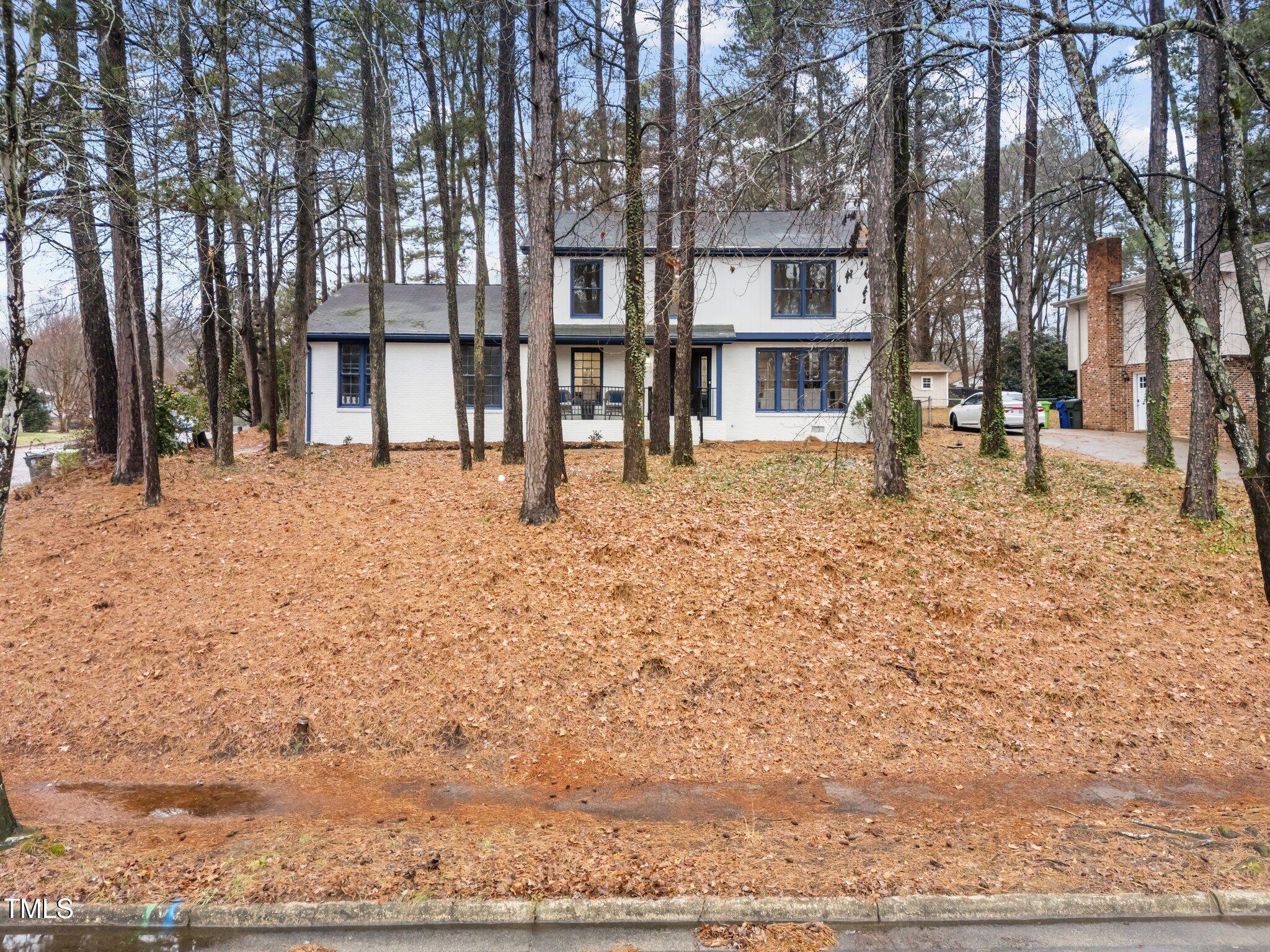 2001 Quail Ridge Road Raleigh, NC 27609 - Photo 3 of 40 a house with trees in the background