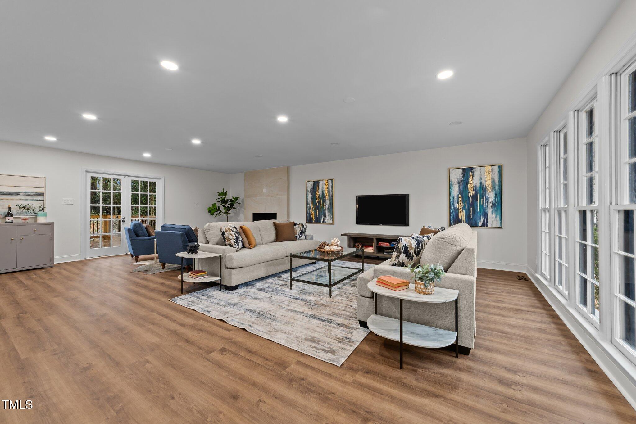 2001 Quail Ridge Road Raleigh, NC 27609 - Photo 5 of 40 a living room with furniture and a flat screen tv