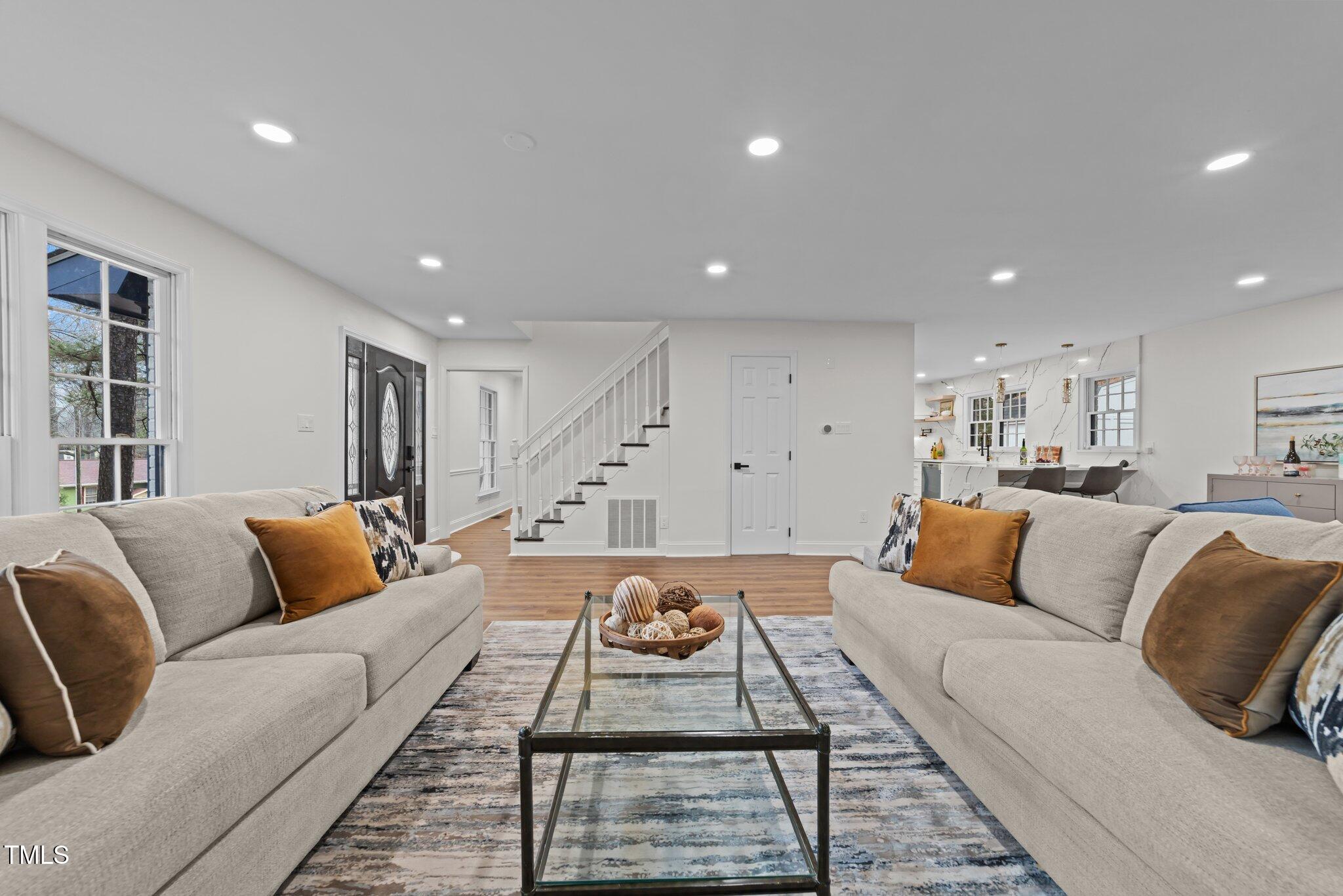 2001 Quail Ridge Road Raleigh, NC 27609 - Photo 6 of 40 a living room with furniture and white walls