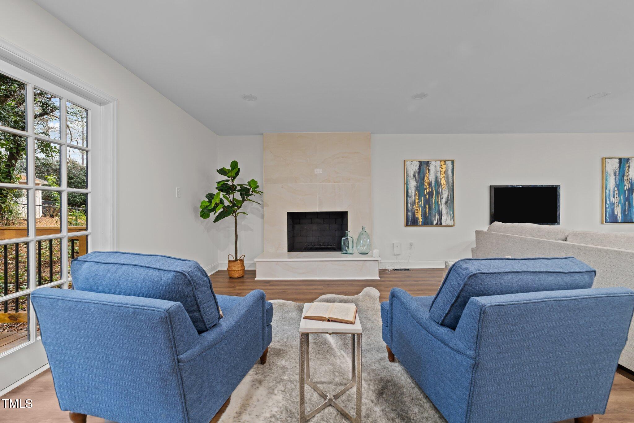 2001 Quail Ridge Road Raleigh, NC 27609 - Photo 7 of 40 a living room with furniture and a flat screen tv