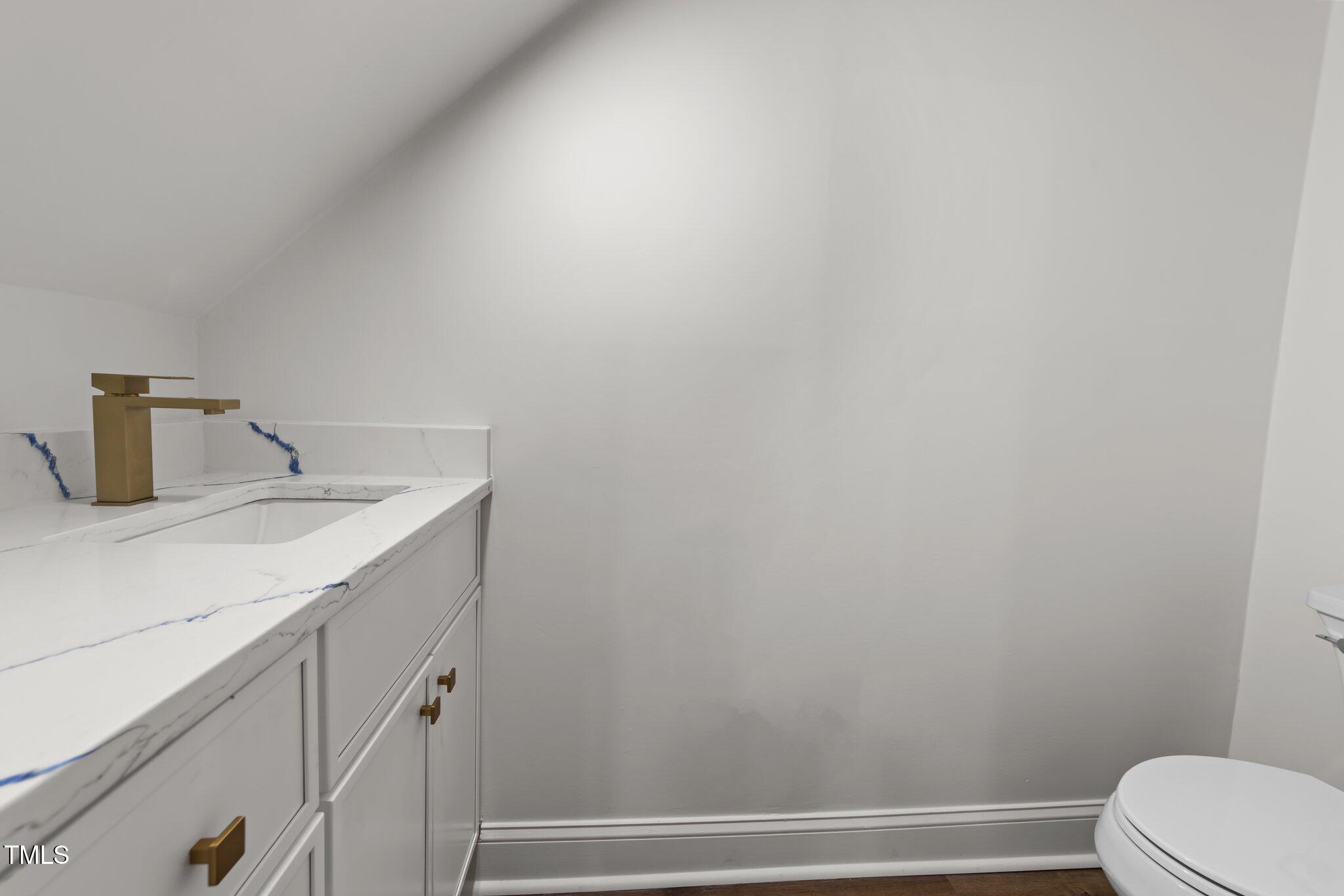 2001 Quail Ridge Road Raleigh, NC 27609 - Photo 8 of 40 a bathroom with a sink and toilet
