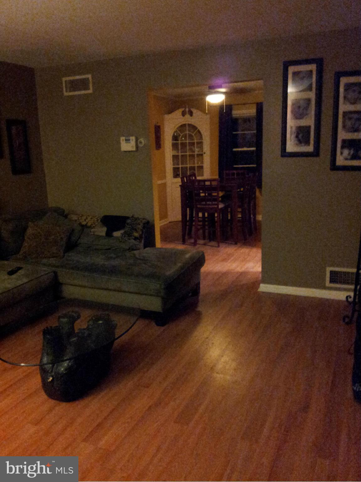 5815 Meridale Road Baltimore, MD 21228 - Photo 14 of 27 a living room with furniture and a wooden floor