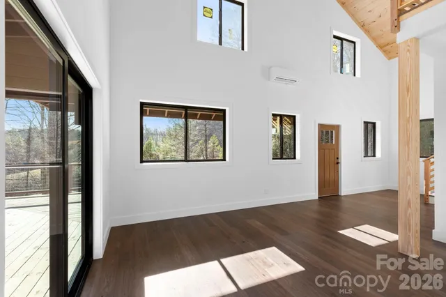 a view of an entryway with wooden floor
