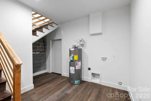 a view of an entryway with wooden floor