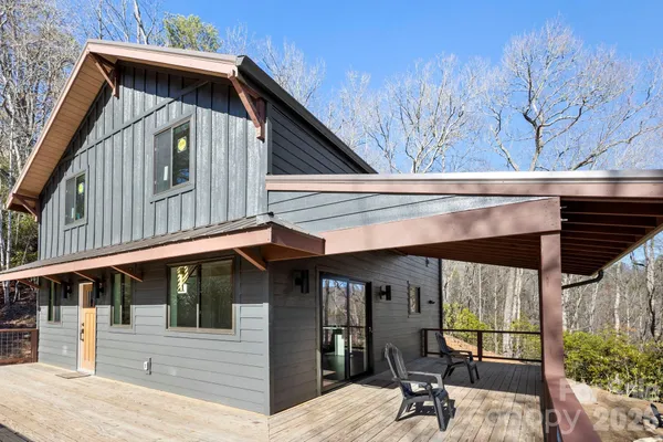 a view of a house with large windows