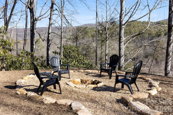 a view of a backyard with sitting area