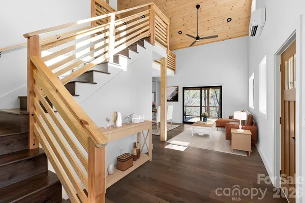 a view of an entryway with wooden floor and furniture