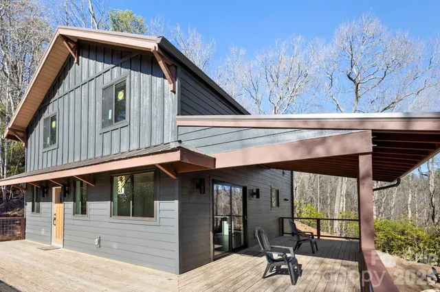 a view of a house with large windows