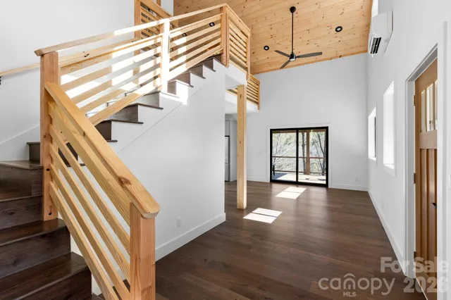 a view of an entryway with wooden floor