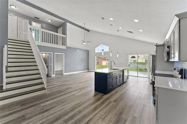 a kitchen with sink cabinets and window