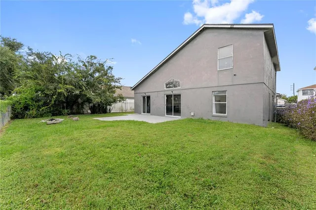 a view of a backyard of the house