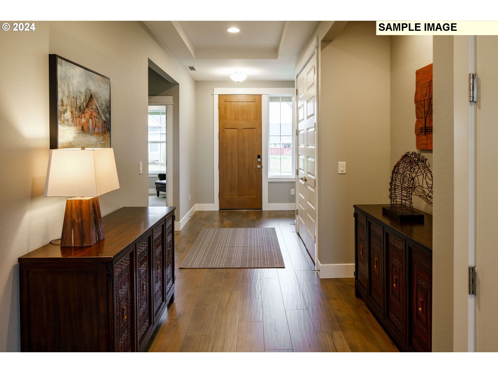 421 North 11th Way Ridgefield, WA 98642 - Photo 5 of 19 a view of hallway with furniture and wooden floor