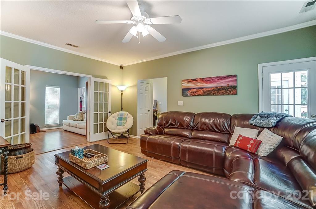 744 West Cheval Drive Fort Mill, SC 29708 - Photo 12 of 47 a living room with furniture a rug and a window