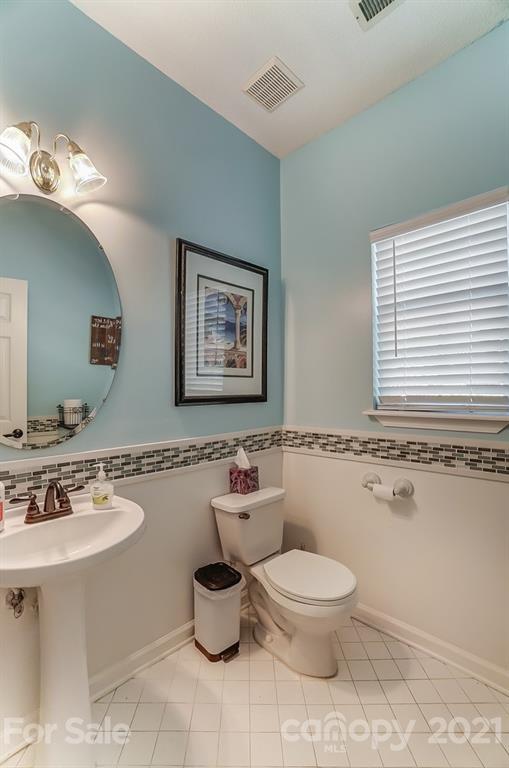 744 West Cheval Drive Fort Mill, SC 29708 - Photo 21 of 47 a bathroom with a toilet sink and mirror