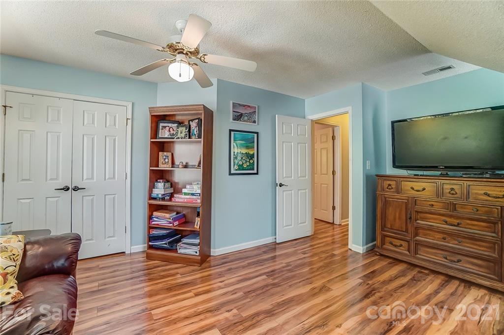 744 West Cheval Drive Fort Mill, SC 29708 - Photo 36 of 47 a living room with furniture and a flat screen tv