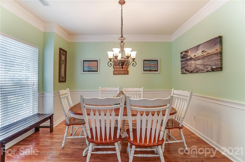 744 West Cheval Drive Fort Mill, SC 29708 - Photo 6 of 47 a view of a dining room with furniture window and wooden floor