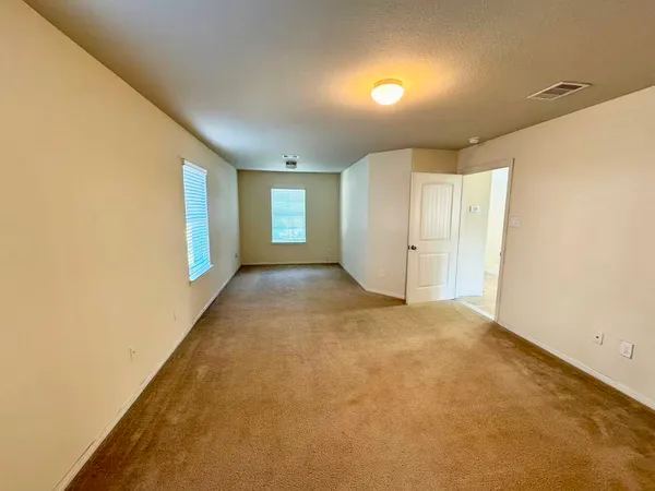 a view of an empty room and window