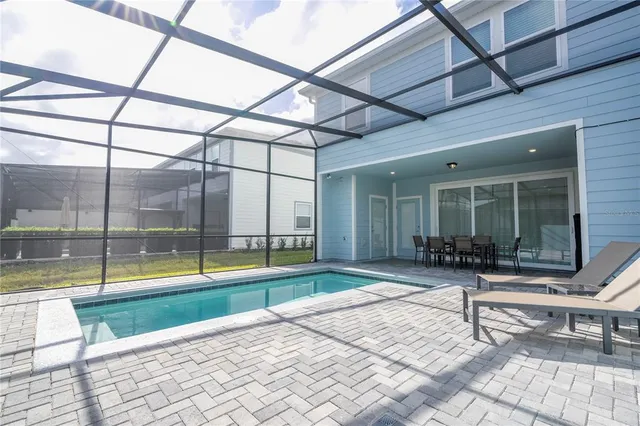 a large kitchen with a large counter top appliances and cabinets