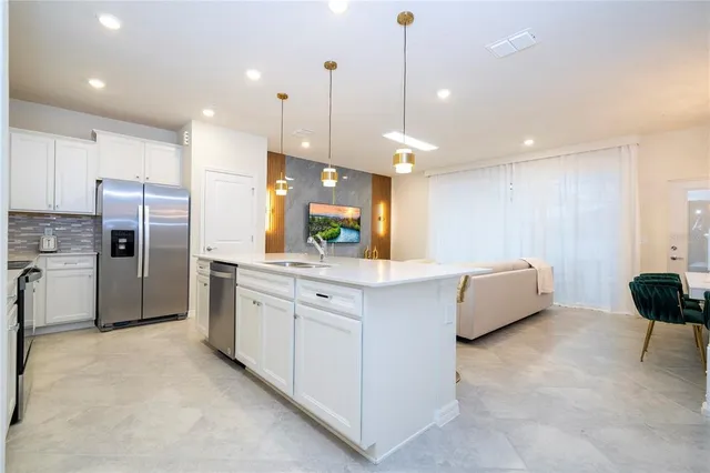 a bedroom with a bed and painting on the wall