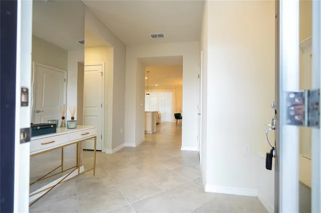 a bedroom with two beds and painting on the wall