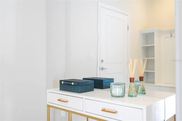 a bedroom with two beds and a lamp