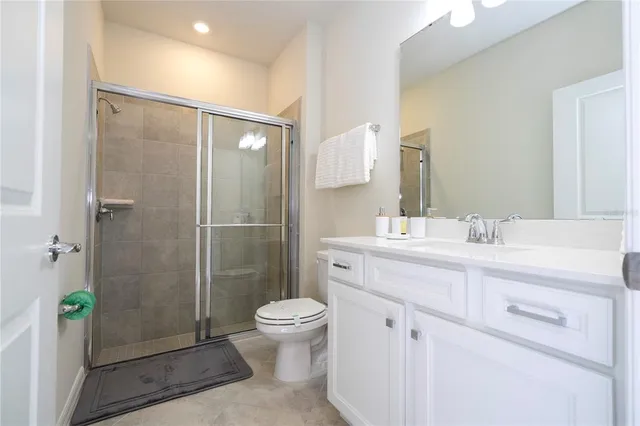 a bedroom with a bed and painting on the wall