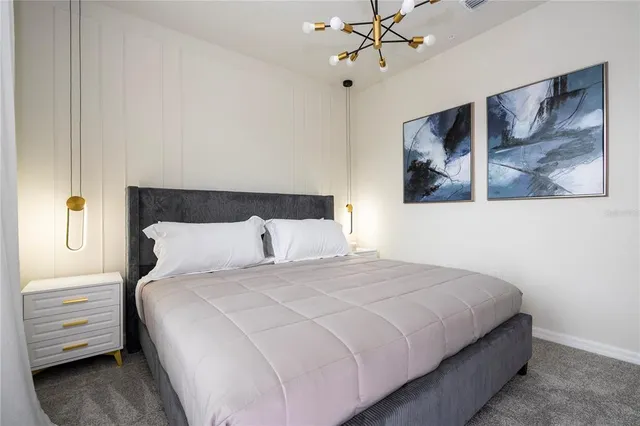 a bedroom with a bed and a couch