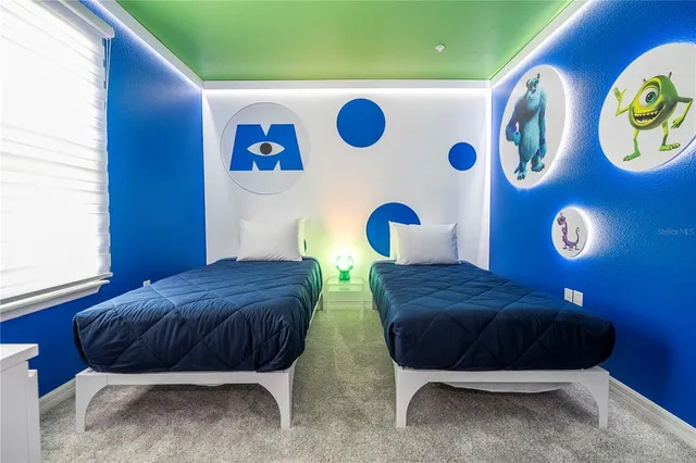 a swimming pool view with a seating space and a lake view