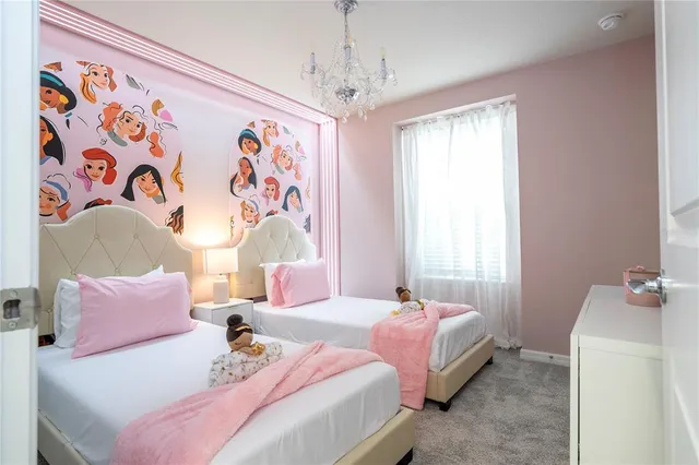 a view of a patio with a table and chairs under an umbrella