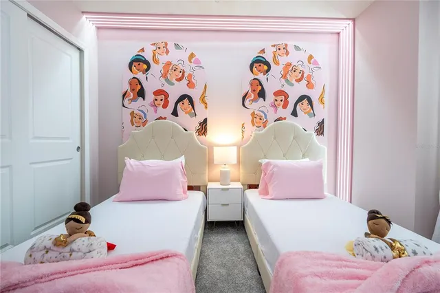 a view of a house with swimming pool and sitting area